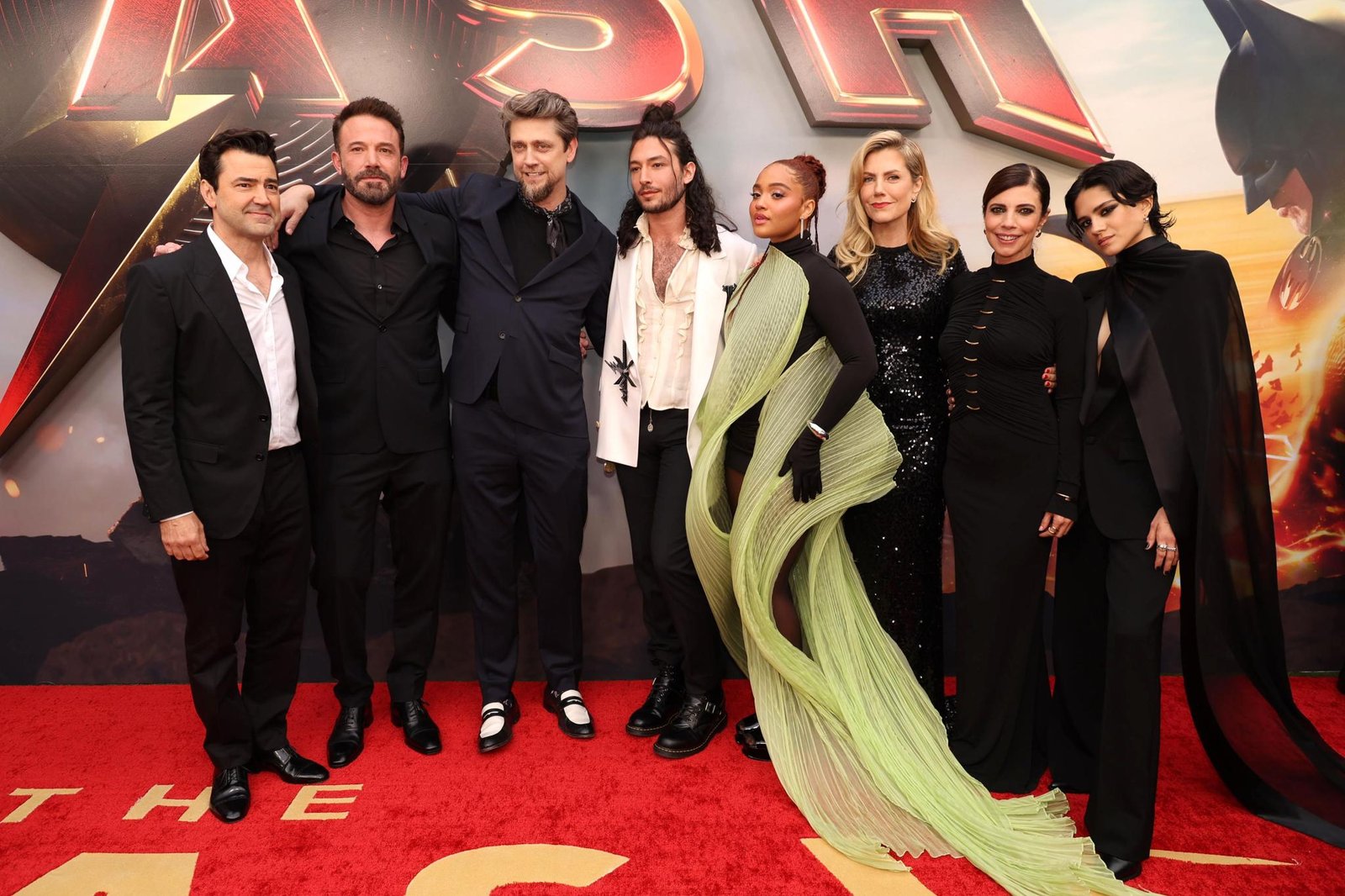 Ezra Miller walks "The Flash" red carpet with co-stars