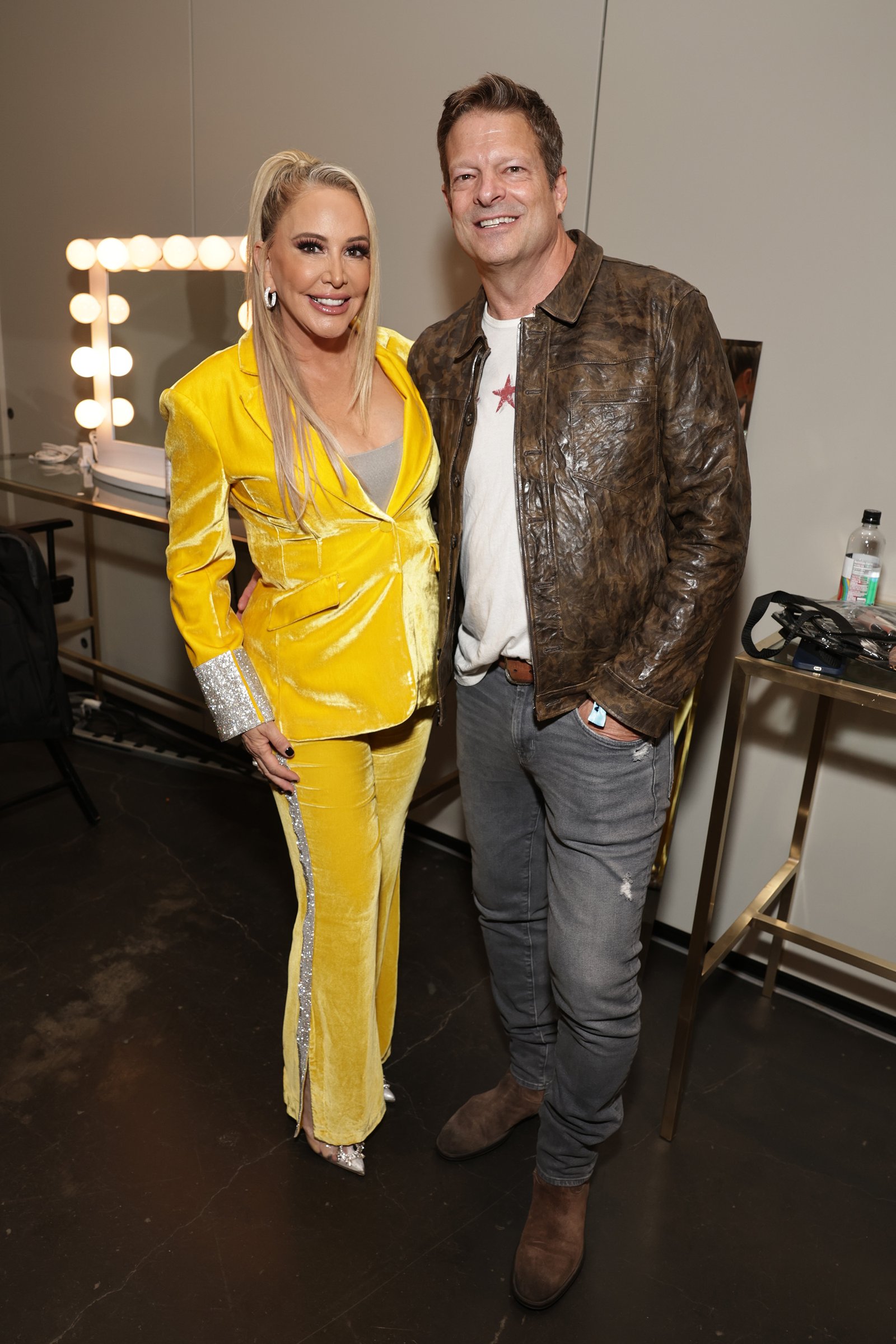 Shannon Beador wears yellow suit posing with David Beador