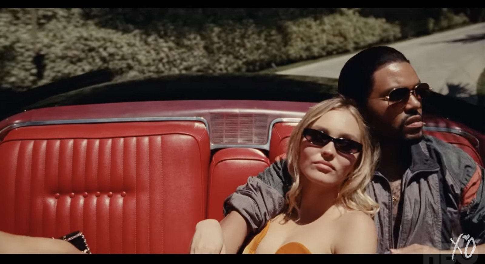 Lily Rose Depp and The Weeknd in convertible in "The Idol"