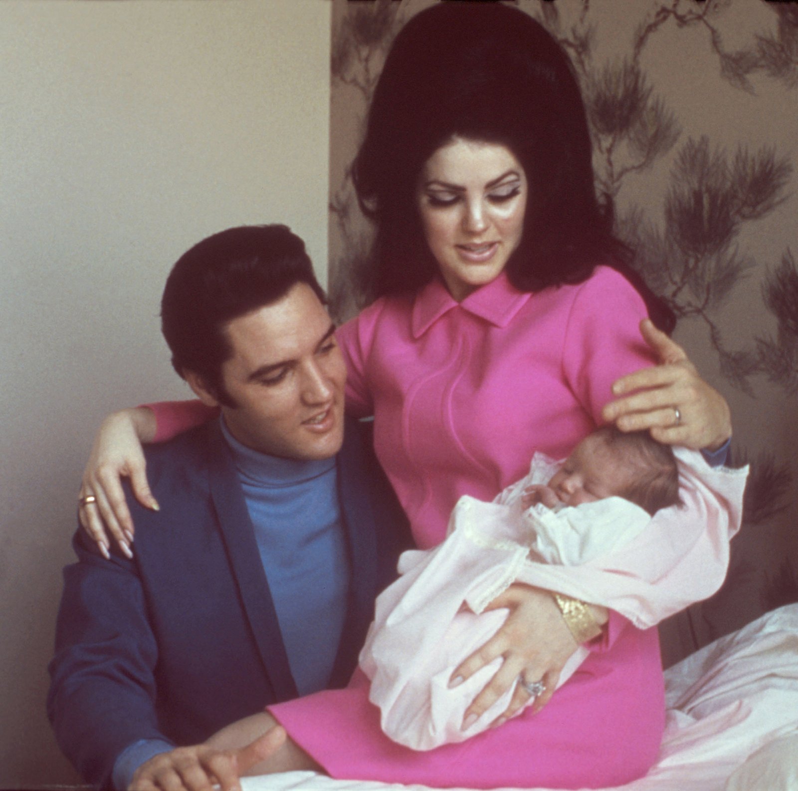 Elvis Presley and Priscilla Presley with Lisa Marie Presley as a baby. 