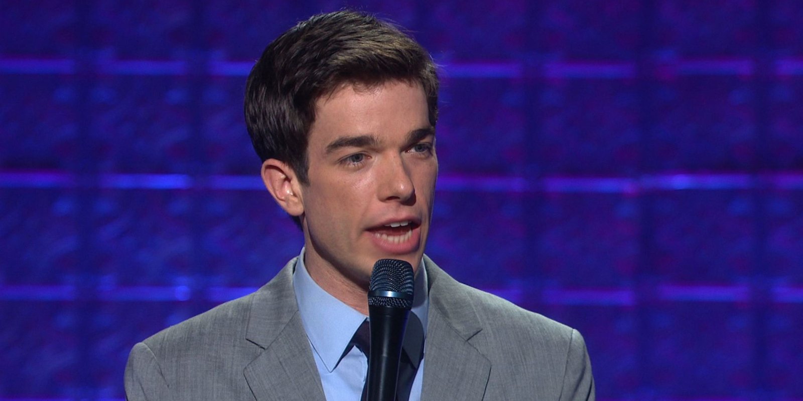 John Mulaney on stage in New in Town