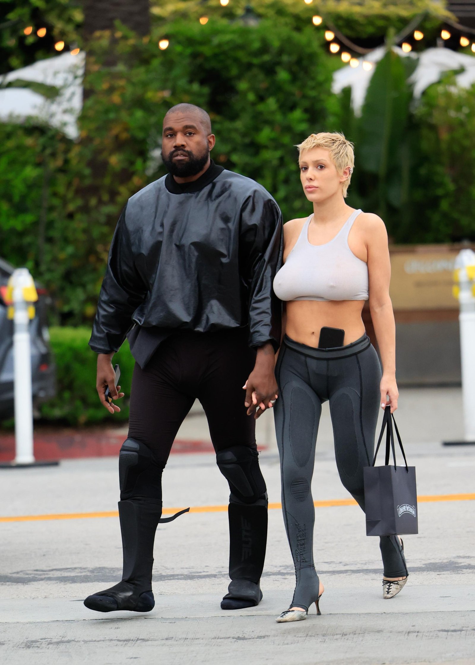 Kanye West and Bianca Censori walking together 