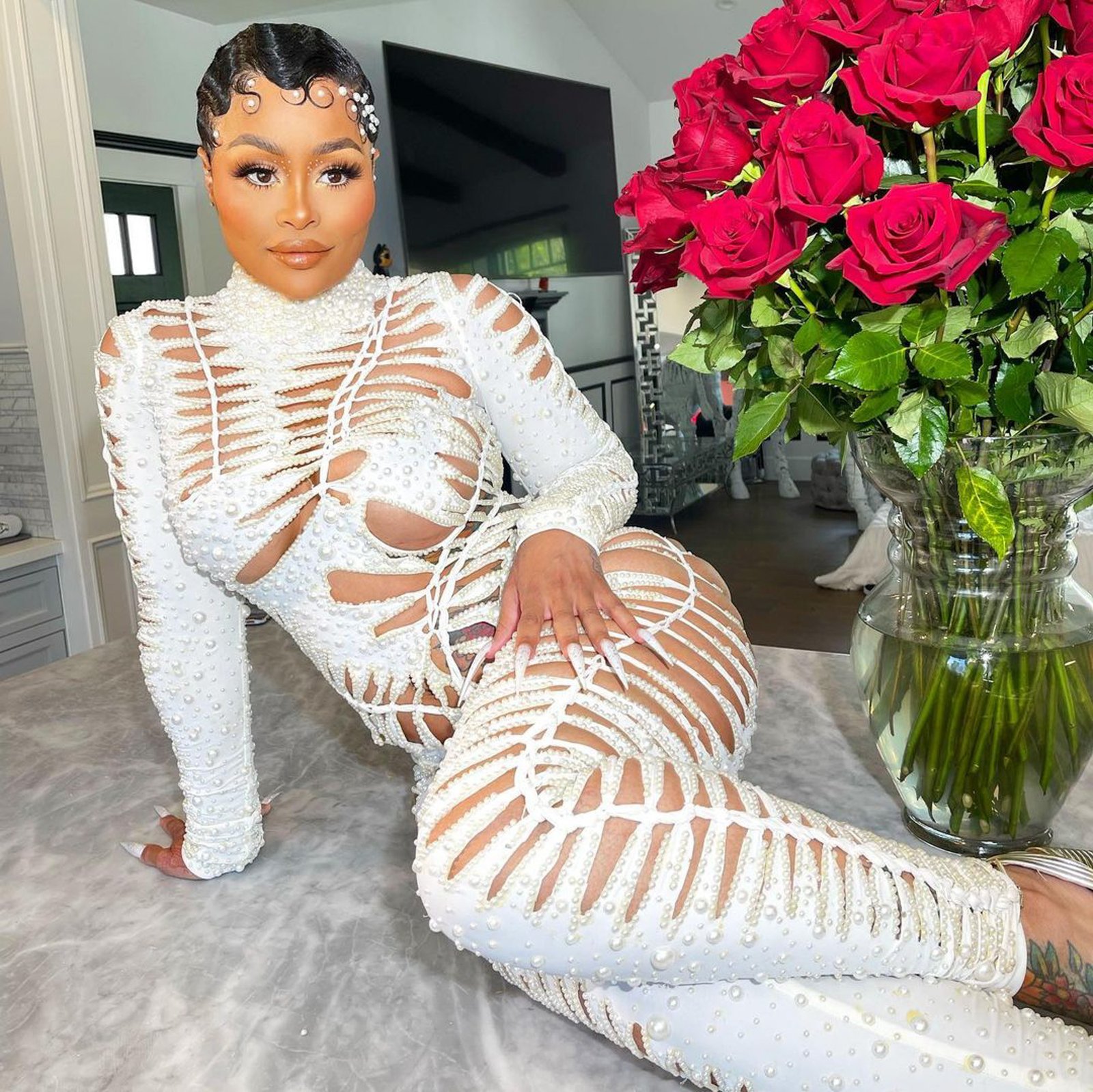 Blac Chyna in a white jumpsuit.
