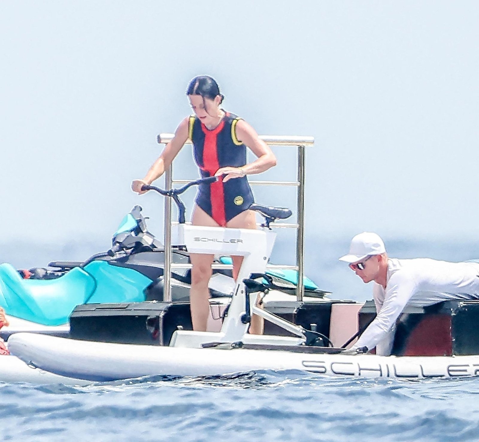Katy Perry on a water bike