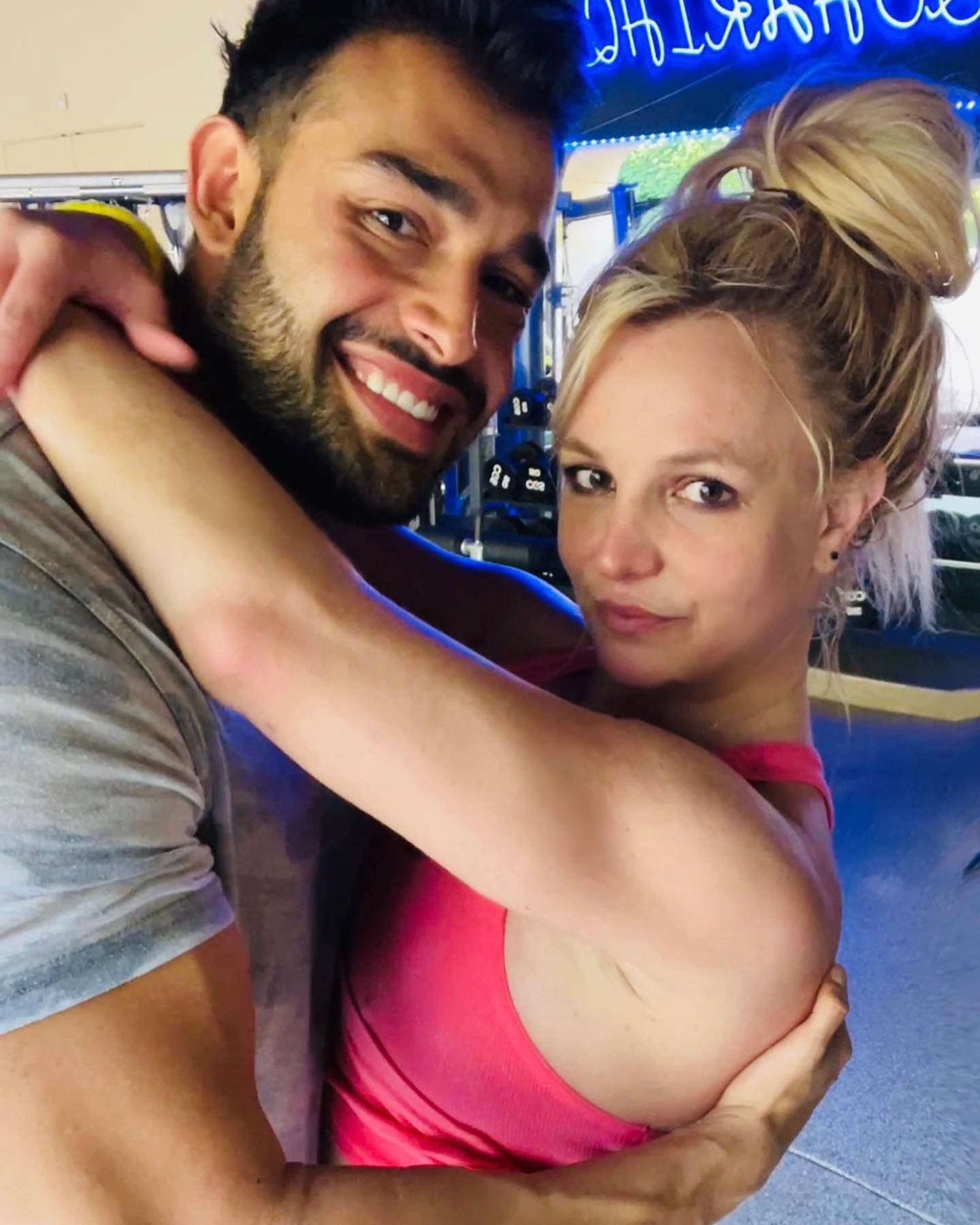 Britney Spears hugging Sam Asghari.