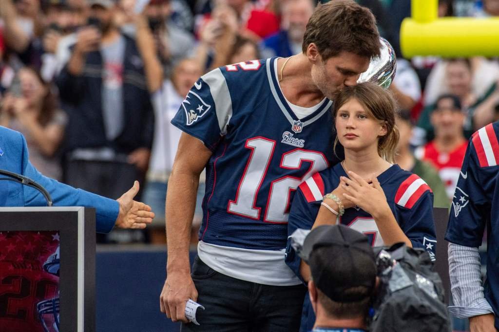 Tom Brady with his kids being honored by the New England Patriots. 